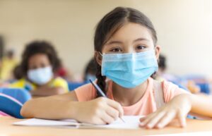 schoolgirl in medical mask